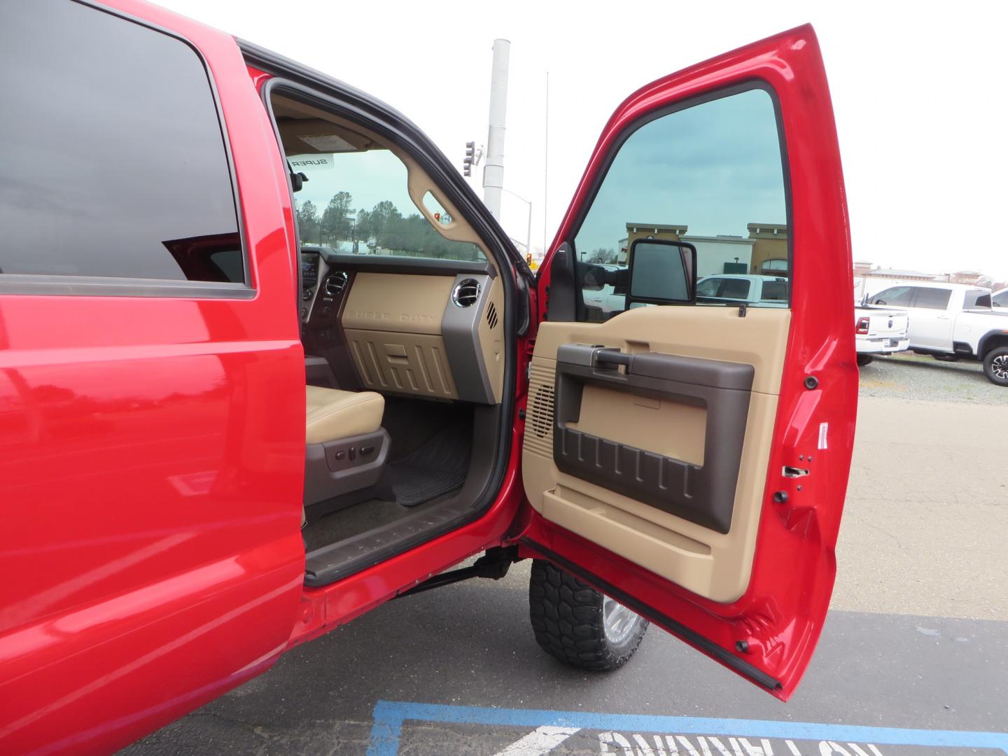 2014 Red /TAN Ford F450 Super Duty Crew Cab Lariat Crew Cab 4WD (1FT8W4DT7EE) with an V8 Turbo Diesel 6.7 Liter engine, Automatic 6-Spd w/SelectShift transmission, located at 2630 Grass Valley Highway, Auburn, CA, 95603, (530) 508-5100, 38.937893, -121.095482 - Wow!! 14 F450 sitting on Icon Vehicle Dynamics suspension, 24" American Force wheels, 37" tires, Rough Country back up leds, Light bar, Window tint, Smoked tail lights 3rd brake light, cab lights, and marker lights, Air bags with compressor, and train horns. Must see this head turner! - Photo#54